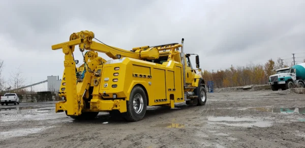 Yellow RTR-16 rotator recovery truck positioned for heavy lifting rescue work