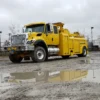 Heavy-duty RTR-16 rotator towing truck by Metro Tow Trucks on construction yard