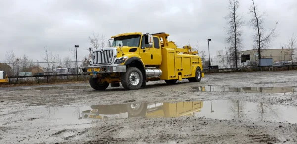 Heavy-duty RTR-16 rotator towing truck by Metro Tow Trucks on construction yard