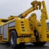 Heavy-duty RTR-16 rotator tow truck with boom raised for industrial recovery