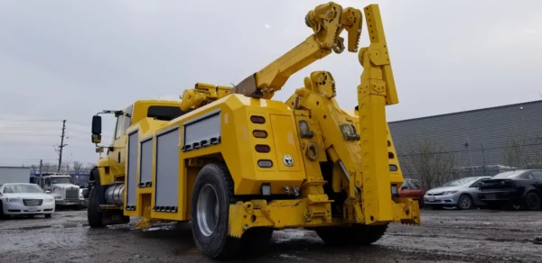 Heavy-duty RTR-16 rotator tow truck with boom raised for industrial recovery