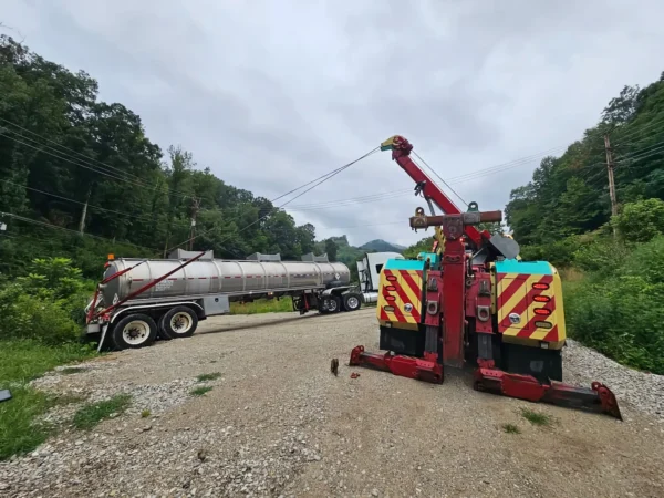 Metro RTR-16 rotator tow truck winching overturned trailer in off-road recovery