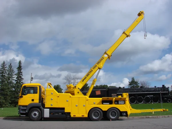 Metro Tow Trucks RTR-35 rotator wrecker lifting with extended boom in heavy-duty rescue operation