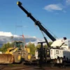 Metro Tow Trucks RTR-50 rotator recovering heavy equipment with boom and winches at roadside job