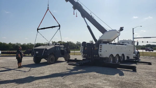 Metro Tow Trucks RTR-50 rotator lifting a armored vehicle using boom and winches