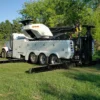 Metro Tow Trucks RTR-50 rotator in a field with outriggers deployed for heavy-duty vehicle towing