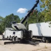 Metro Tow Trucks RTR-50 rotator lifting a semi-trailer during heavy recovery operation