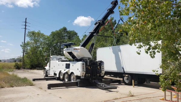 Metro Tow Trucks RTR-50 rotator lifting a semi-trailer during heavy recovery operation