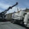 Metro Tow Trucks RTR-50 rotator handling tanker truck recovery in industrial emergency scene