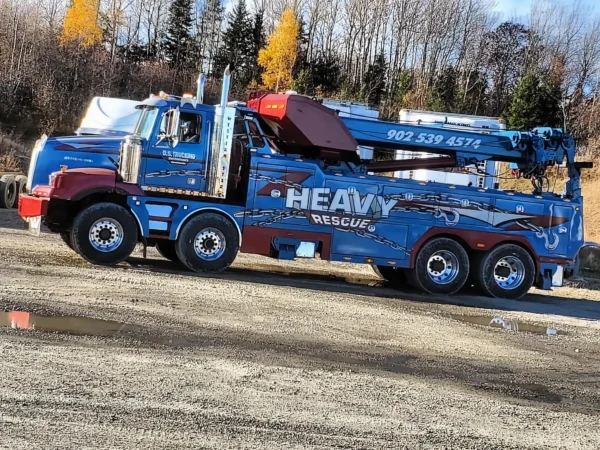 Metro Tow Trucks RTR-50 rotator in blue HEAVY RECOVERY livery, parked on job site