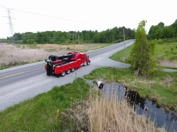 Metro Tow Trucks RTR-50 heavy recovery rotator responding roadside with red body and boom