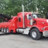 Metro Tow Trucks RTR-50 red rotator tow truck deploying outriggers for heavy lift recovery