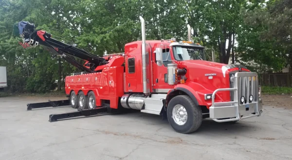 Metro Tow Trucks RTR-50 red rotator tow truck deploying outriggers for heavy lift recovery