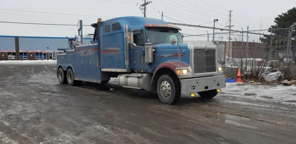 Metro Tow Trucks RTR-50 heavy-duty rotator tow truck parked roadside for emergency recovery service