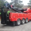 Metro Tow Trucks RTR-50 red heavy rotator tow truck with extended outriggers ready for lifting
