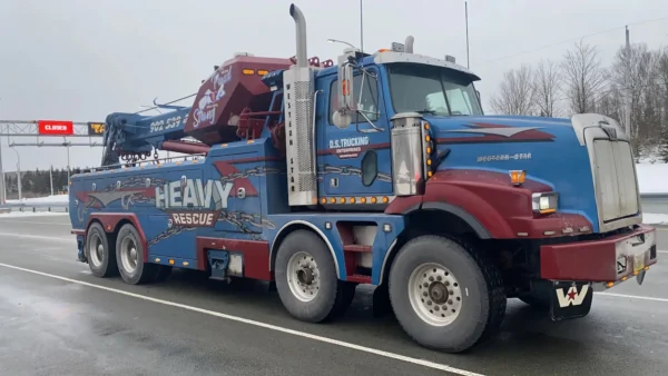 Metro Tow Trucks RTR-50 blue heavy-duty rotator wrecker in highway towing service