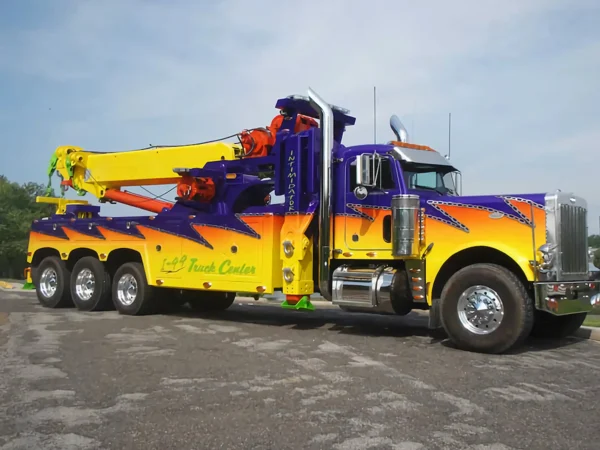 Metro RTR-70 70-ton rotator with custom show paint on display in towing fleet yard
