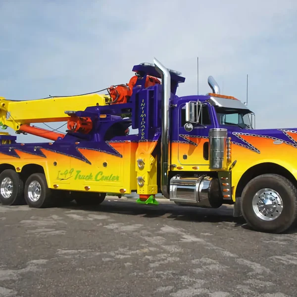 Metro RTR-70 70-ton rotator with custom show paint on display in towing fleet yard
