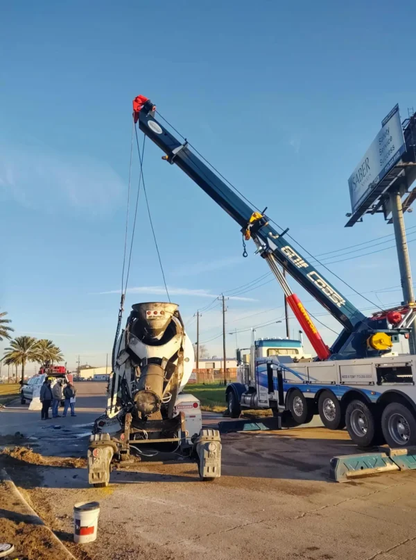 Metro RTR-70 heavy rotator lifting construction equipment during recovery operation
