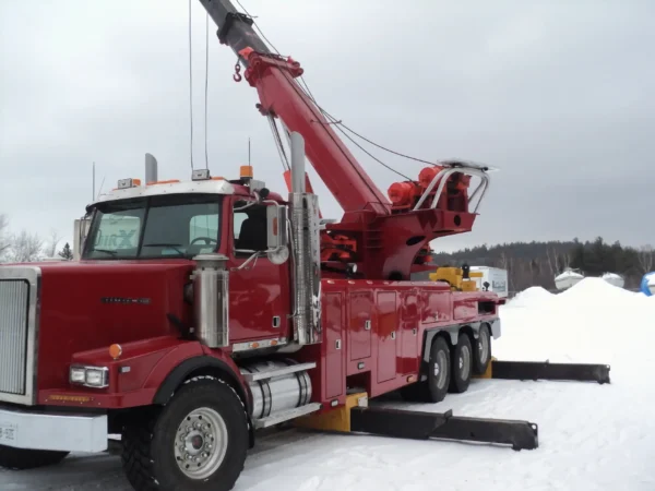 Metro RTR-70 70-ton rotator deployed in snowy roadside heavy recovery setup