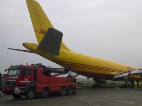 Metro RTR-70 rotator positioned for aircraft tail tow at airport