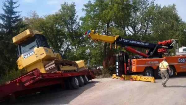 Metro RTR-70 heavy rotator performing trailer and loader recovery operation