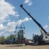 Metro Heavy Recovery 35 wrecker performing dual-line lift on industrial equipment