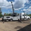Metro Heavy Recovery 35 wrecker performing dual-line lift on industrial equipment