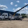 Metro Heavy Recovery 35 wrecker operating long boom extension for recovery work