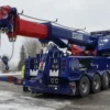 Metro Heavy Recovery 70 blue wrecker performing heavy lift with boom setup