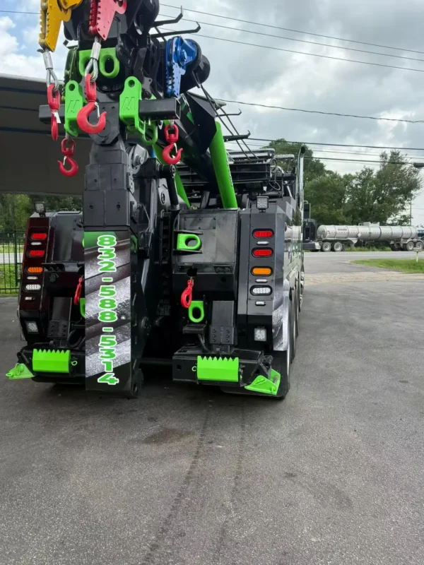 Metro IND-60 independent wrecker rear view showing underlift, winches, and tow equipment