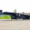 STT-50 extendable heavy-duty trailer parked on a lot, shown empty with full deck length visible