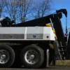 Close-up of MDTU-20 detachable wrecker body and boom on a tandem-axle chassis, on-road setup