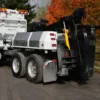 MDTU-20 detachable wrecker body mounted on white semi-truck with boom and underlift deployed
