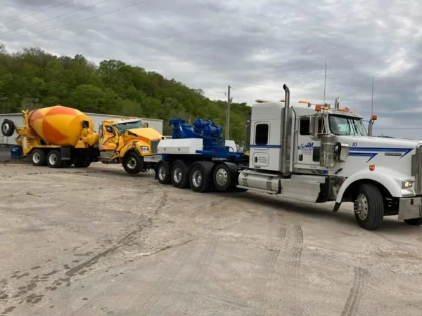 MDTU-35 heavy recovery unit hauling a concrete mixer truck on a multi-unit transport combination