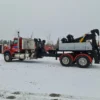 MDTU-35 detachable towing unit on red heavy-duty truck during winter testing