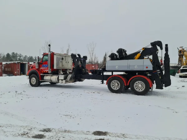 MDTU-35 detachable towing unit on red heavy-duty truck during winter testing