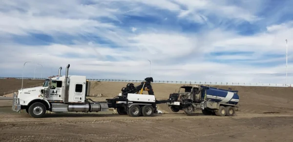 MDTU-35 unit recovering a broken-down dump truck on suburban road