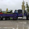 Metro RTR-25 rotator heavy wrecker driving on site for commercial truck recovery