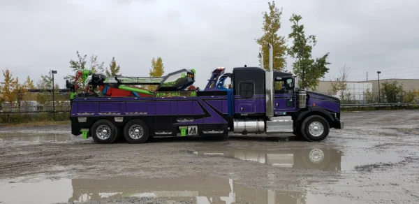 Metro RTR-25 rotator heavy wrecker driving on site for commercial truck recovery