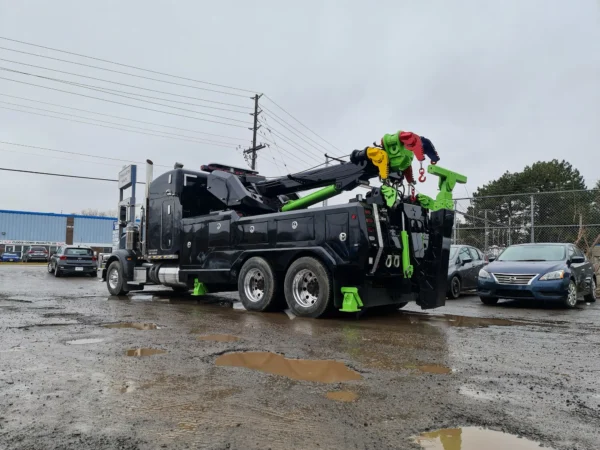 Black RTR-25 rotator wrecker in field recovery setup