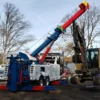 Metro RTR-25 rotator lifting excavator during onsite equipment recovery