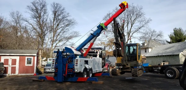 Metro RTR-25 rotator lifting excavator during onsite equipment recovery