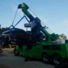 Metro Tow Trucks RTR-25 rotator wrecker lifting a car from roadside accident scene