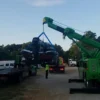 Metro Tow Trucks RTR-25 heavy duty rotator lifting a car with extended boom during vehicle recovery