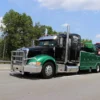 Metro Tow Trucks RTR-25 rotator heavy wrecker driving on road for recovery service