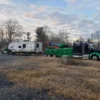 Metro Tow Trucks RTR-25 rotator towing a disabled RV in a rural roadside recovery