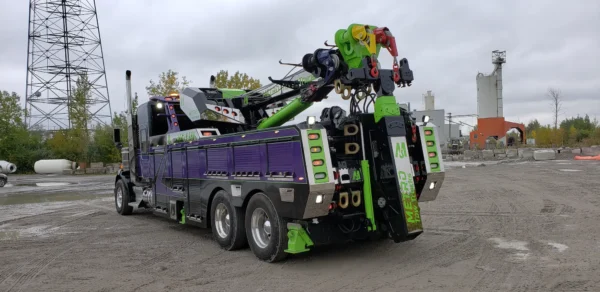 Rear view of Metro RTR-25 rotator showing boom and hydraulic winch system