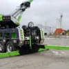 Green and purple RTR-25 rotator with extended boom and underlift for towing