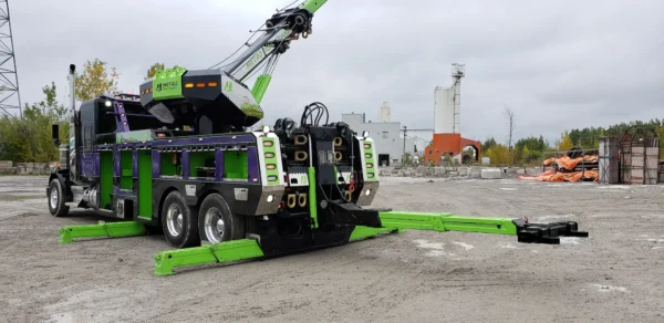 Green and purple RTR-25 rotator with extended boom and underlift for towing